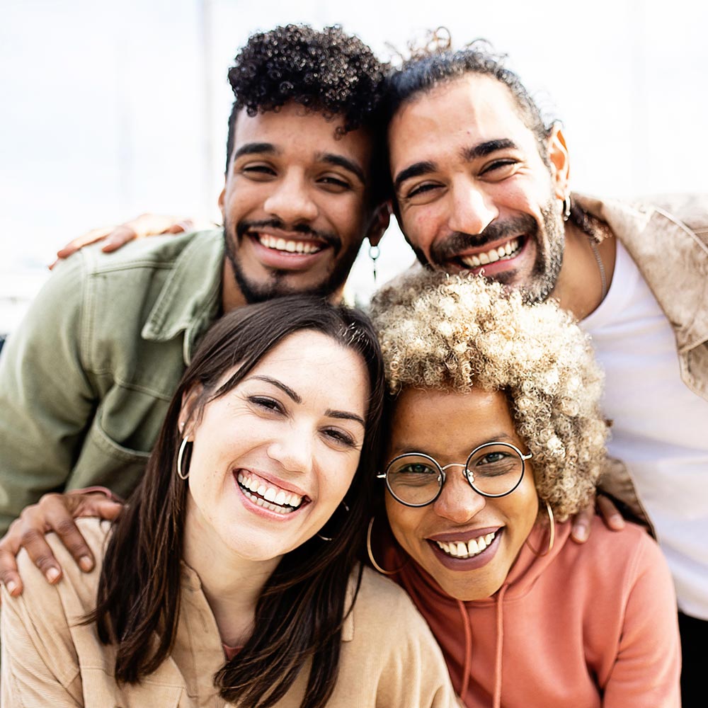 Group portrait of four multiracial united friends for Innovia Behavioral Health